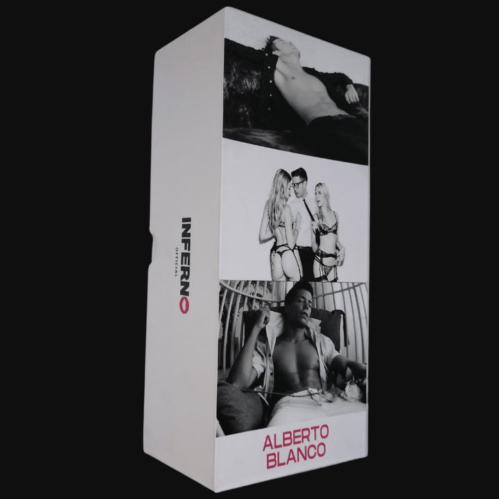 A brown, realistic dildo with a detailed, lifelike texture. It is shown next to a photo album with erotic images in the background.