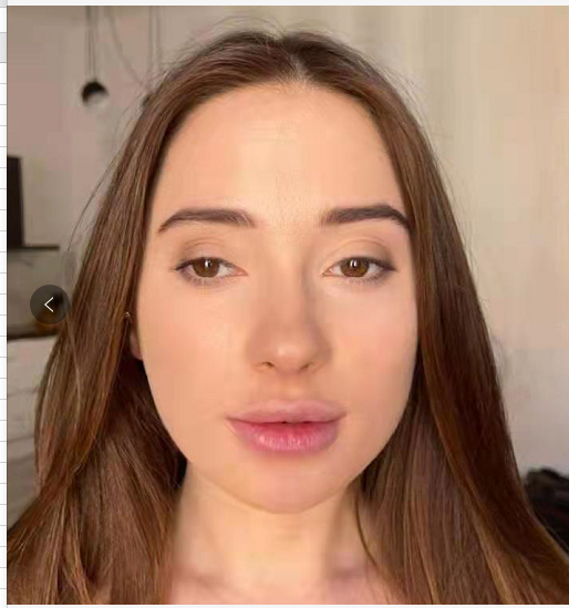 A silicone head doll with human hair, posed in a standing position against a white background. The doll has a realistic appearance, resembling a young woman, with a delicate build and natural curves.